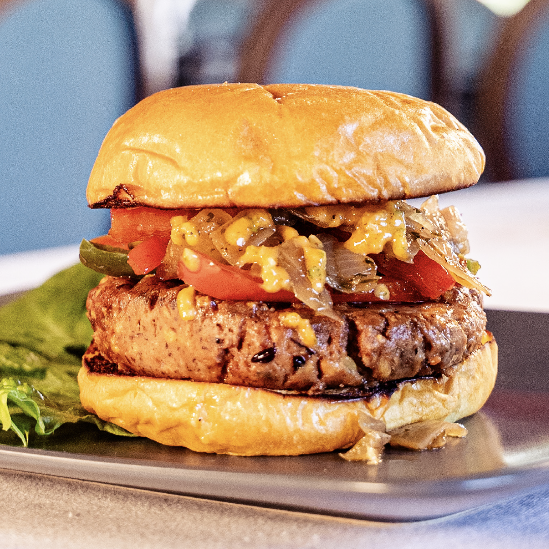 A Bahama Burger patty on an exquisitely prepared burger.