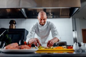 Smiling chef preparing a meal