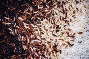 Several colors of rice mixed together
