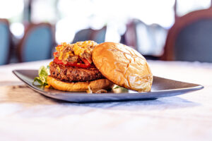 A delicious Bahama burger plated in a diner setting.